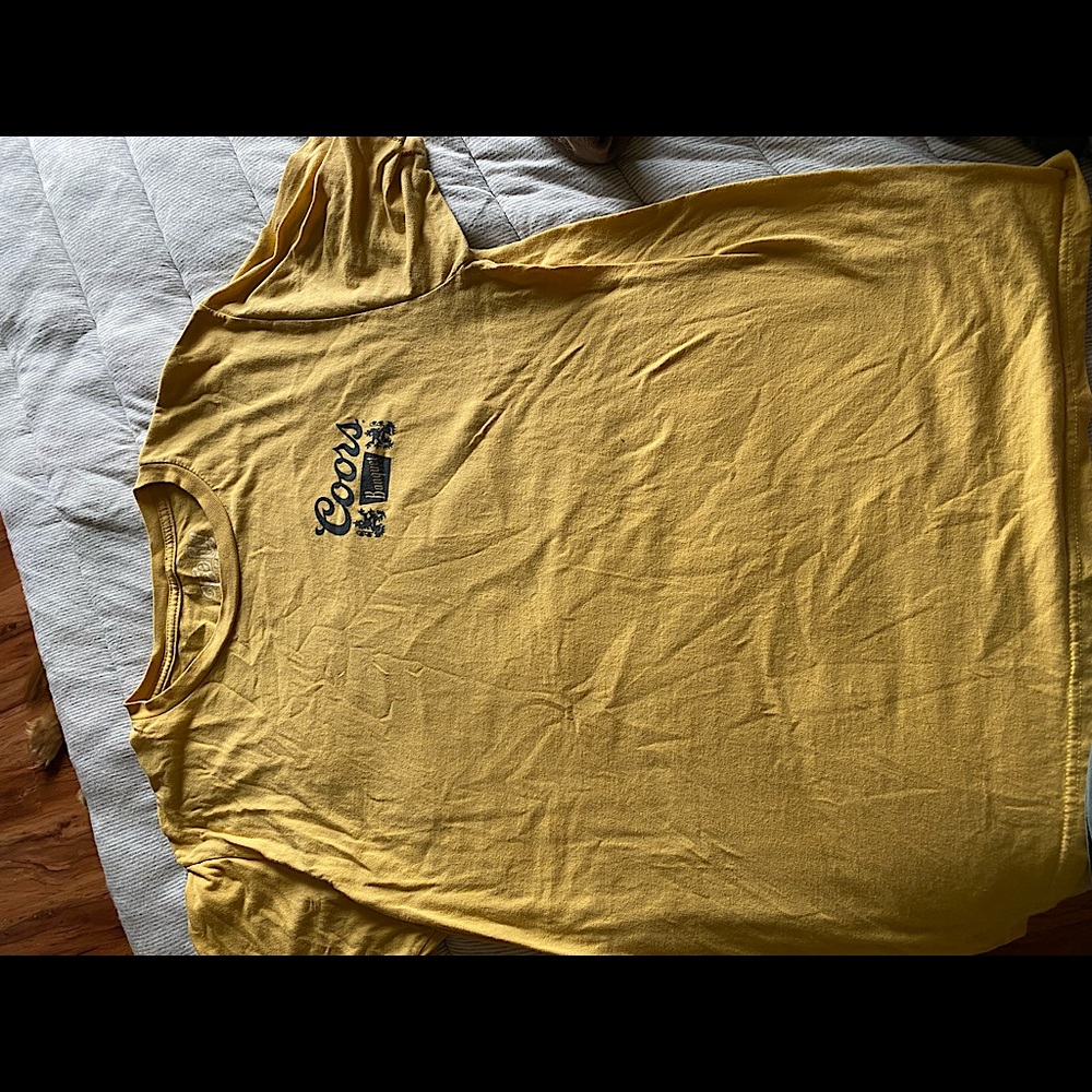 Yellow Coors Light T. Light material with a nice design on the back. Large